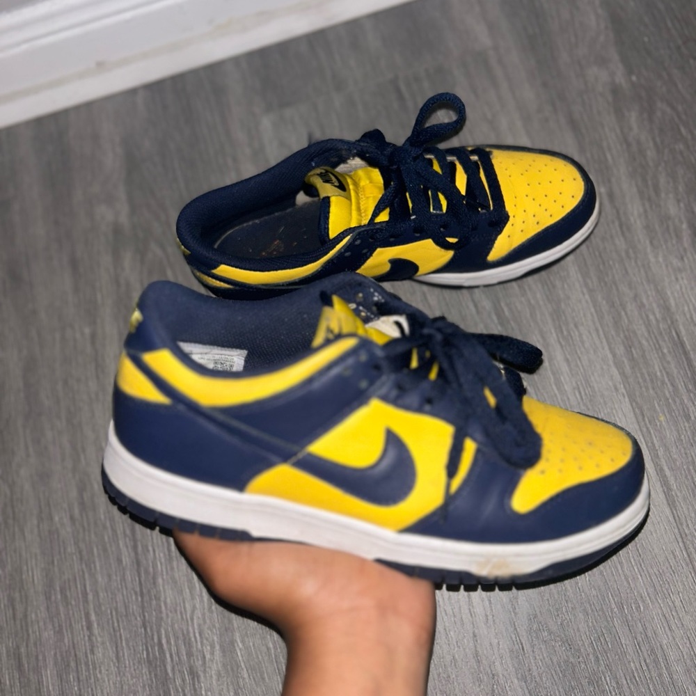 The upper of the Nike Dunk Low Michigan is made of Varsity Maize leather
